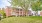 a large brick building with trees in front of it