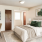 Staged apartment bedroom with desk and bed