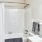 a bathroom with a bathtub and sink